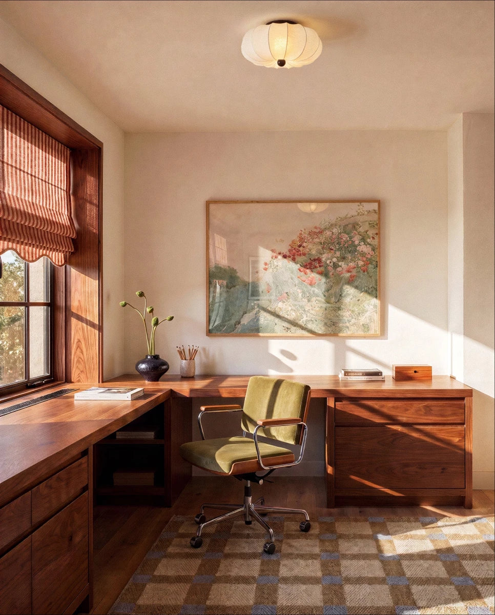 Clérachic ceiling light glowing above a wood-paneled home office with a desk and framed botanical print.