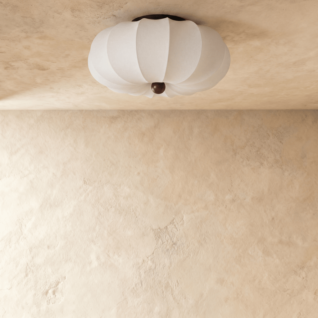 Clérachic ceiling light with a scalloped fabric drum shade, shown glowing from a slightly different angle.