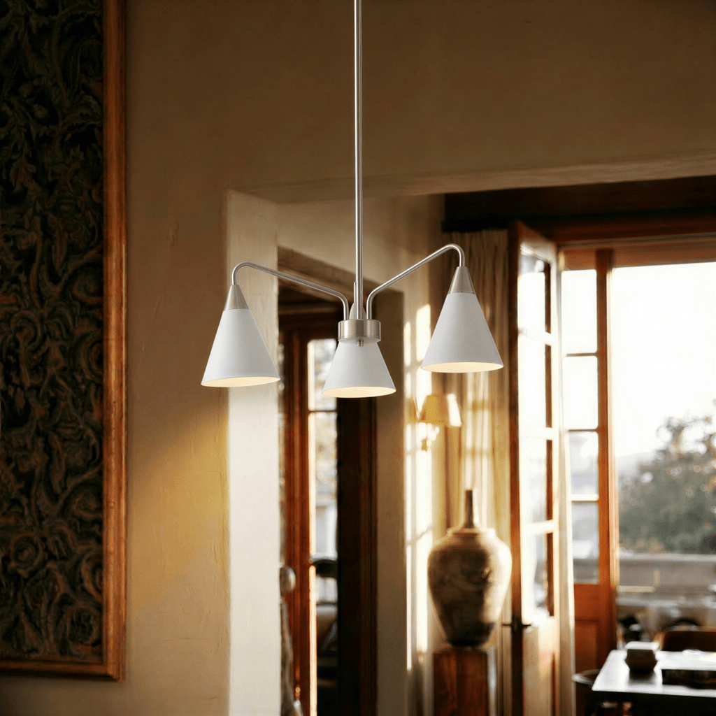 This Clérachic three-arm chandelier glows warmly beneath a wood-slat ceiling in a sunlit Mediterranean room.