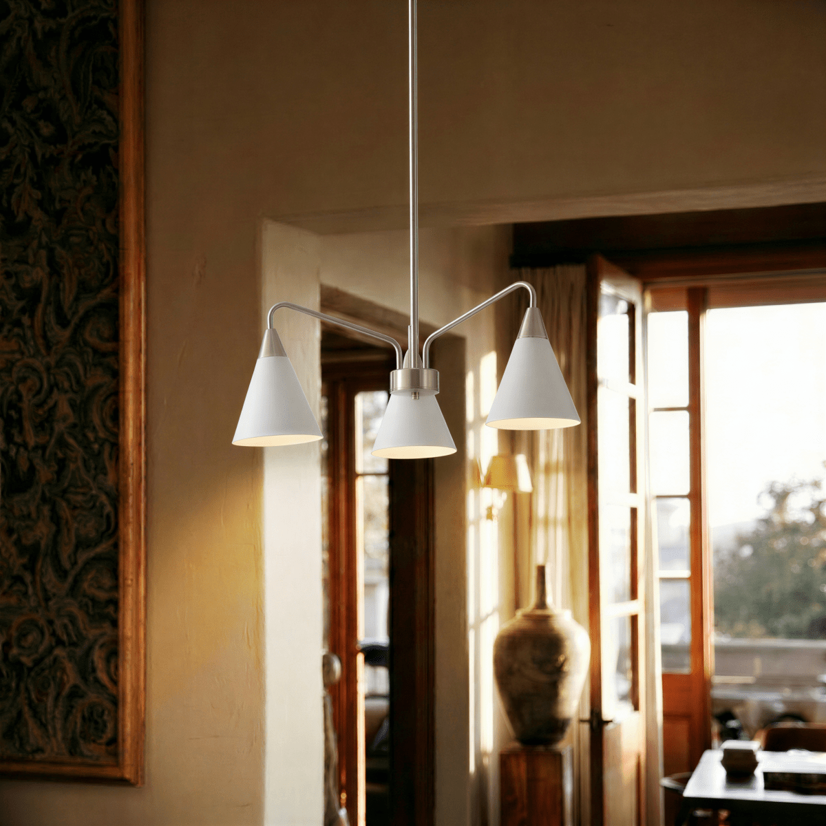 This Clérachic three-arm chandelier glows warmly beneath a wood-slat ceiling in a sunlit Mediterranean room.
