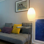 Side profile of the faux silk bubble table lamp and round chrome base