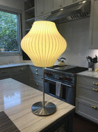Close detail of the faux silk bubble shade's soft texture and curved form