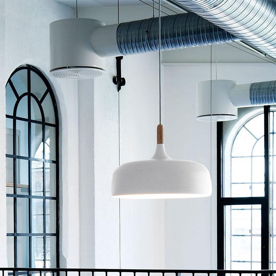 Acorn pendant light shown lit against a dark backdrop
