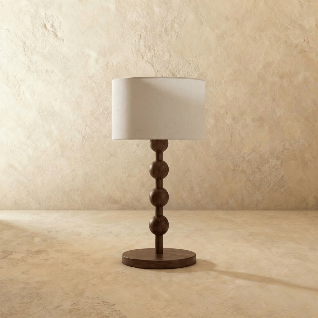 Clérachic walnut bobbin lamp seen straight on, showing the turned column and disc foot