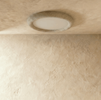 Clérachic stone ceiling light shown switched off, the matte pale acrylic disc sitting below the rim of the travertine ring.