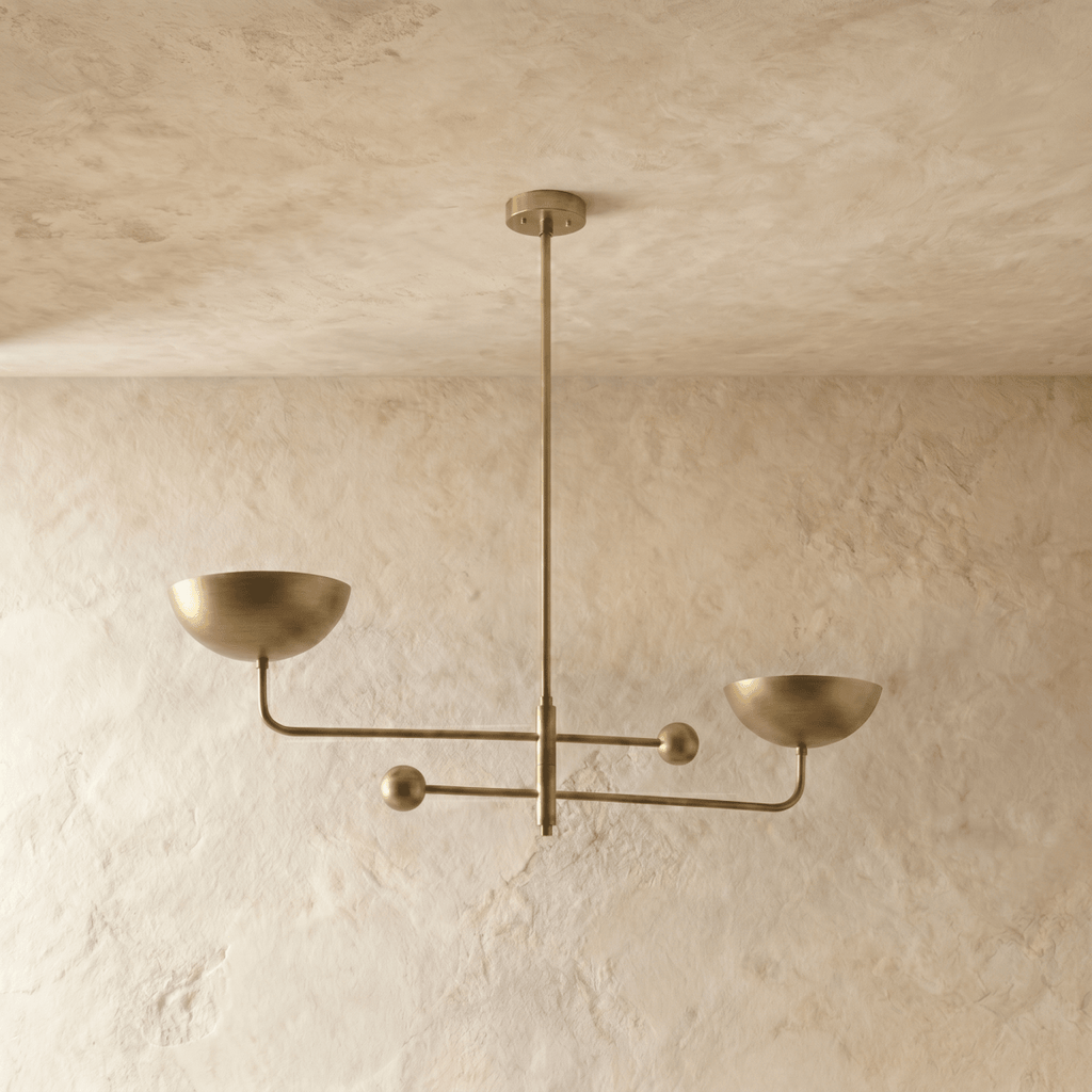 Clérachic chandelier in polished brass, the crossed arms and bowl shades shown from a different angle.