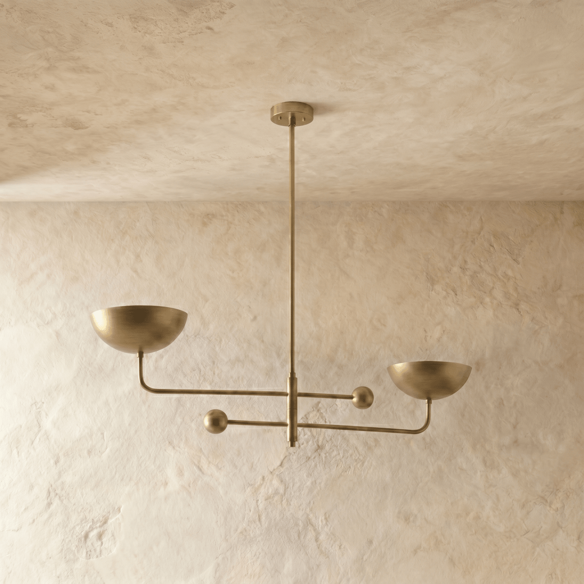 Clérachic chandelier in polished brass, the crossed arms and bowl shades shown from a different angle.