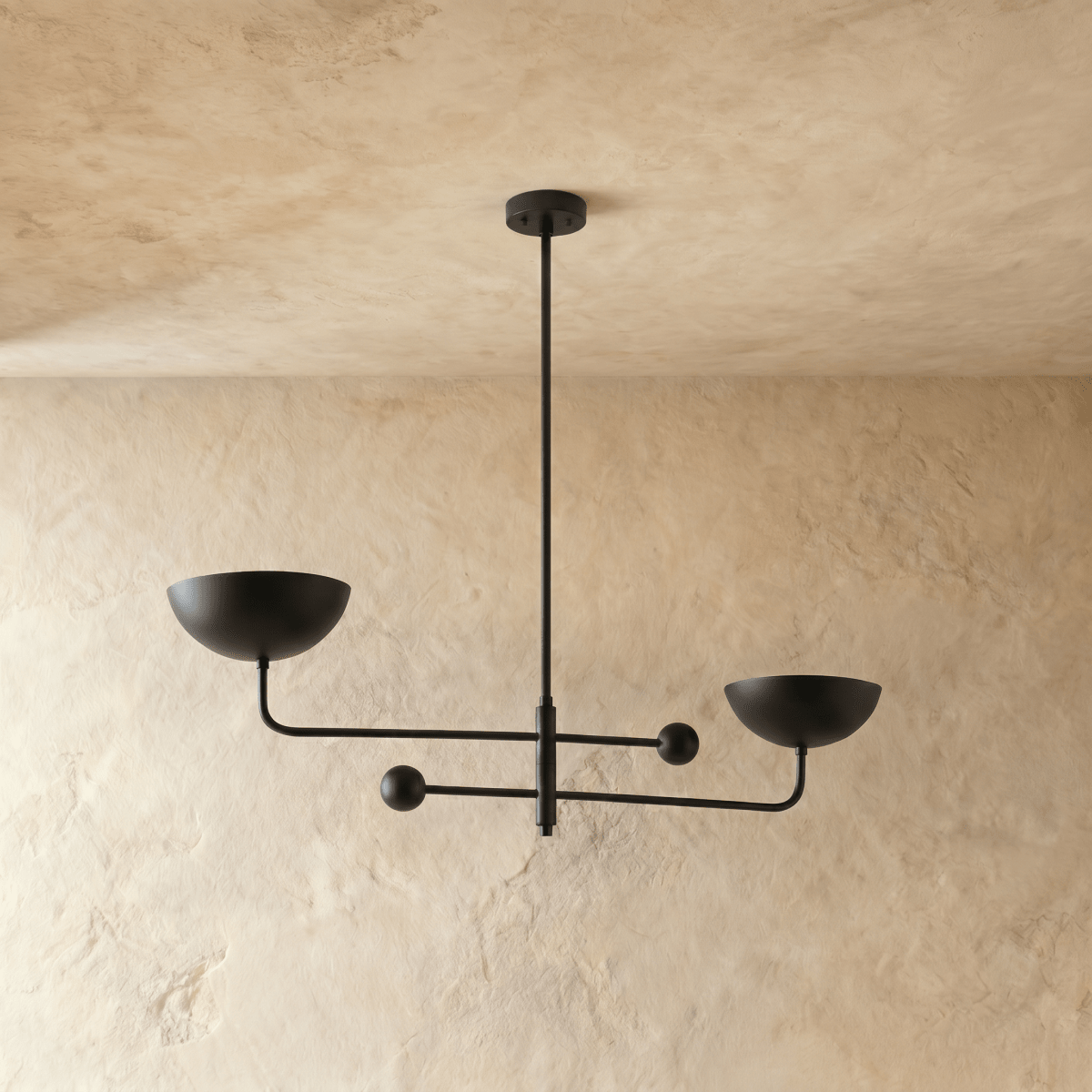 Clérachic chandelier in matte black, the crossed arms and bowl shades viewed from another angle.