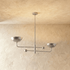 Clérachic chandelier in a bright chrome finish, its two balanced arms and bowl shades against a plaster ceiling.