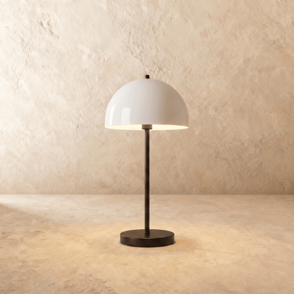 Clérachic table lamp in matte black, its glossy white dome shade rising from a slender black stem.
