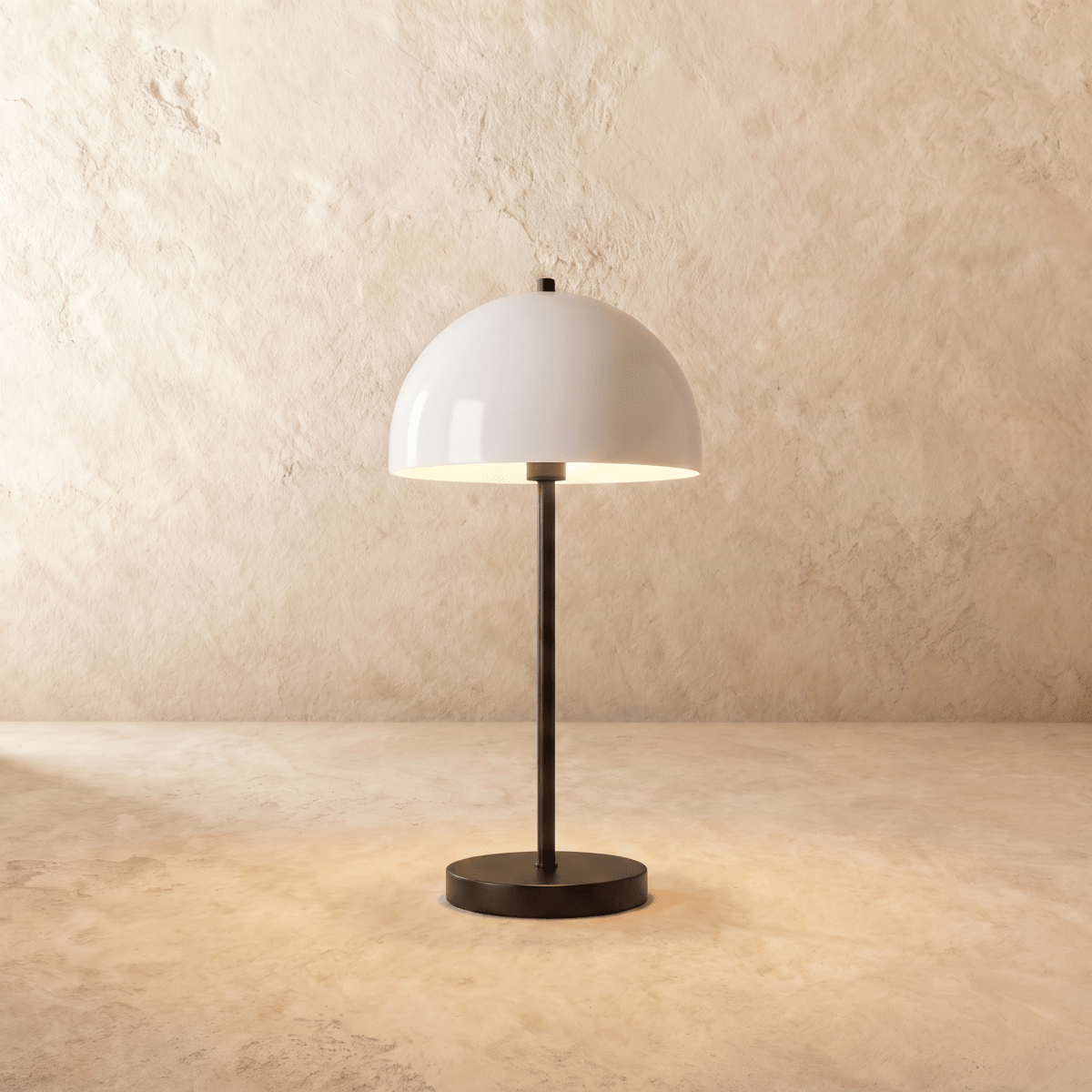 Clérachic table lamp in matte black, its glossy white dome shade rising from a slender black stem.