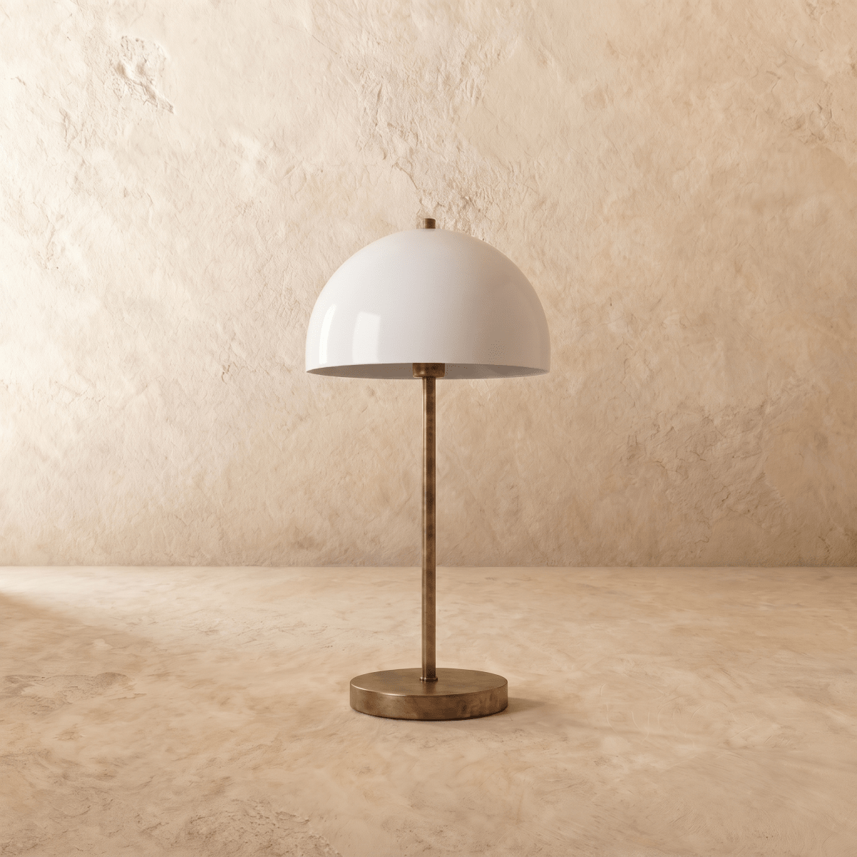This vintage brass Clérachic table lamp is shown from another angle, its white dome shade glowing softly.