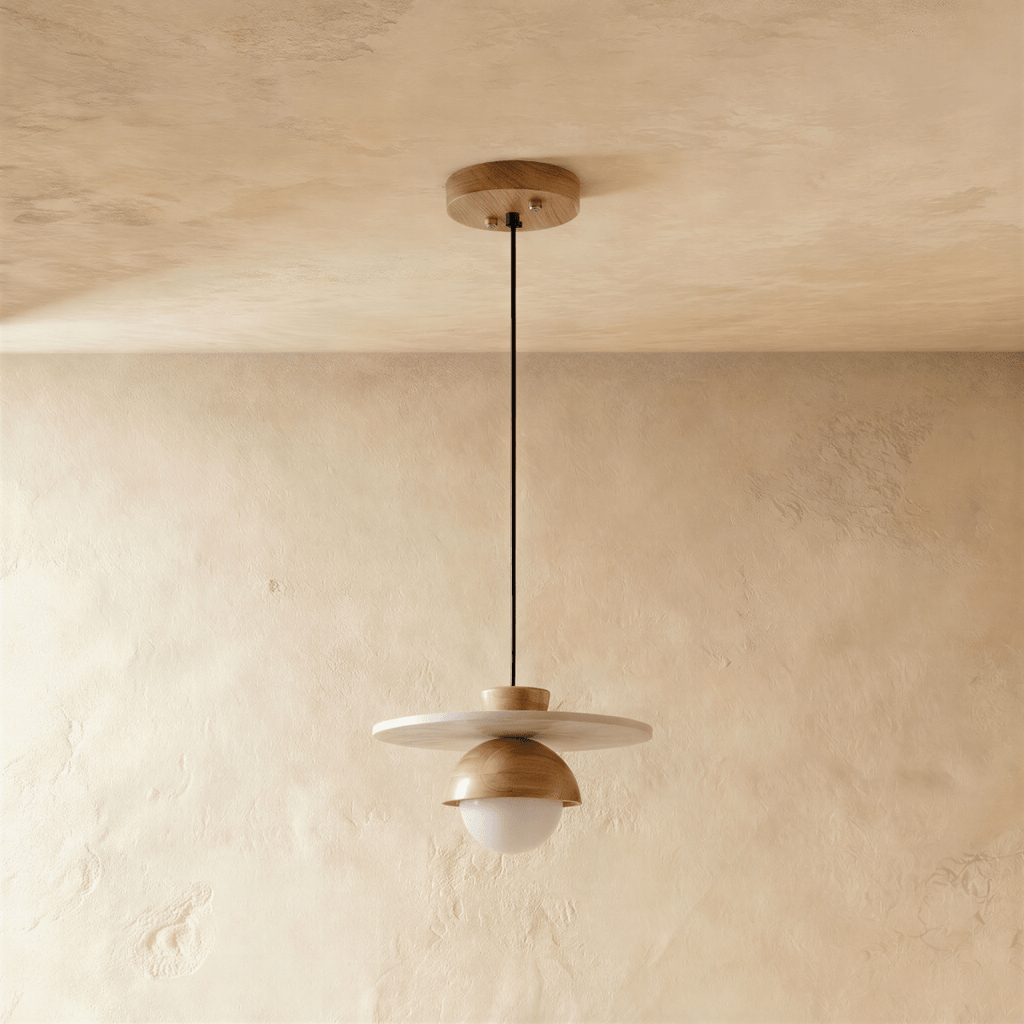 Clérachic pendant light in light wood, the flat disc and glass globe shown from a slightly different angle.