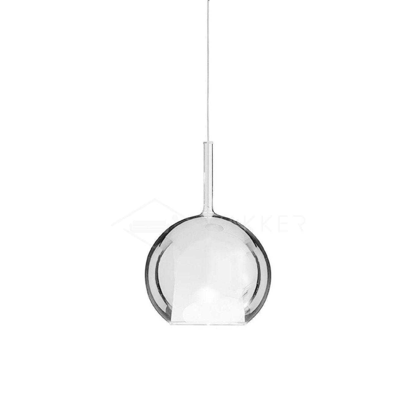 Glass globe pendant light glowing warmly in a quiet corner