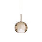 Tinted blown glass globe pendant light with sculptural glow