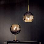 Blown glass globe pendant light with slim suspension cable