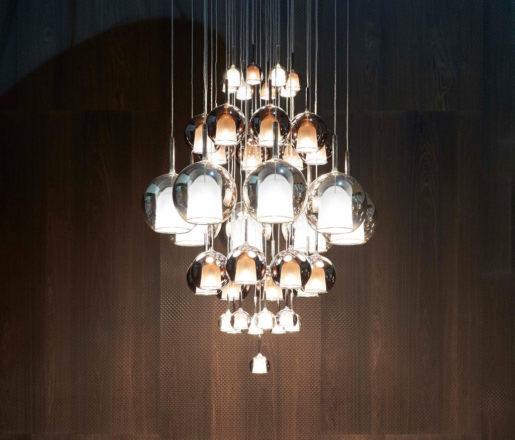 Glass globe pendant light shown against a neutral backdrop