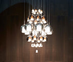 Glass globe pendant light shown against a neutral backdrop