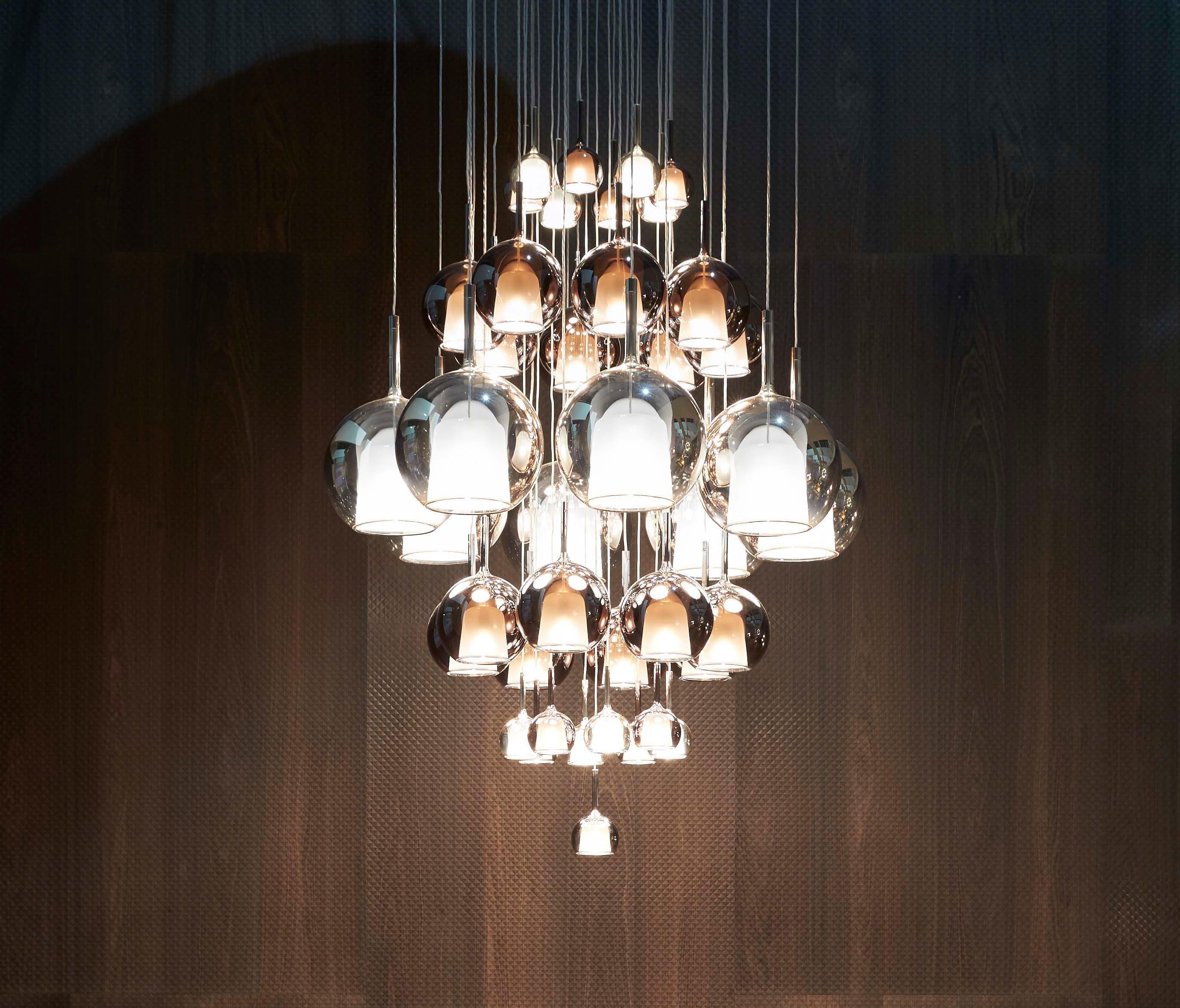 Glass globe pendant light shown against a neutral backdrop