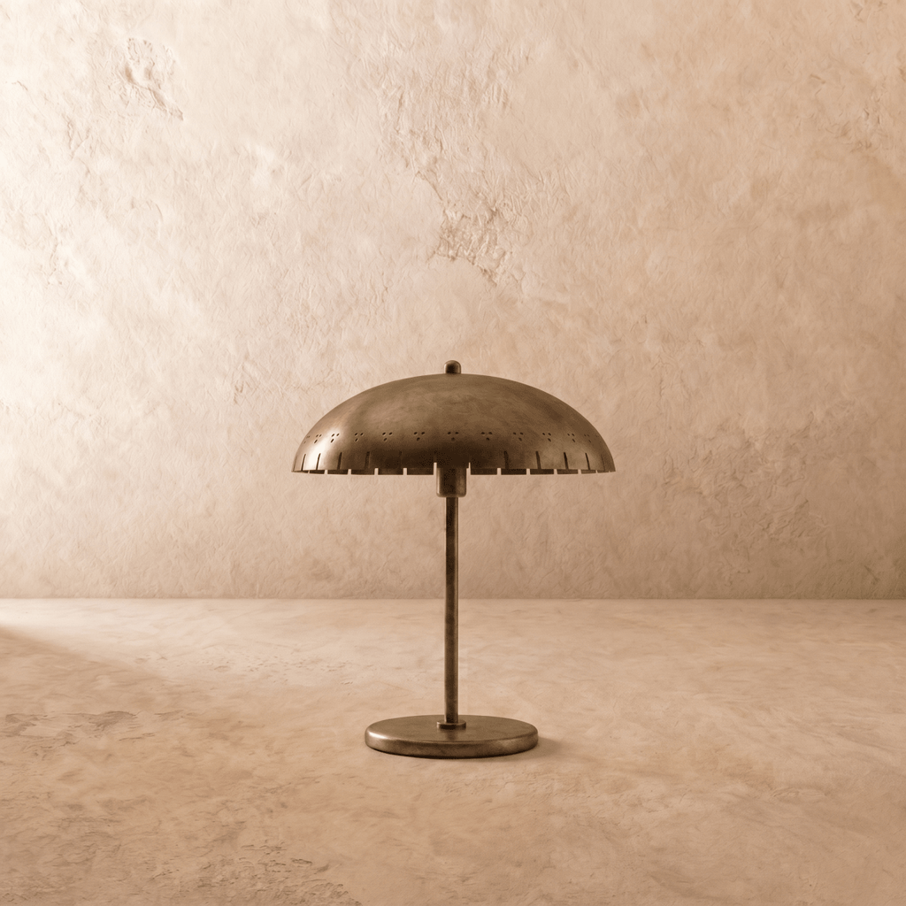 Clérachic table lamp in vintage brass, close view of the perforated dome shade and slim stem.
