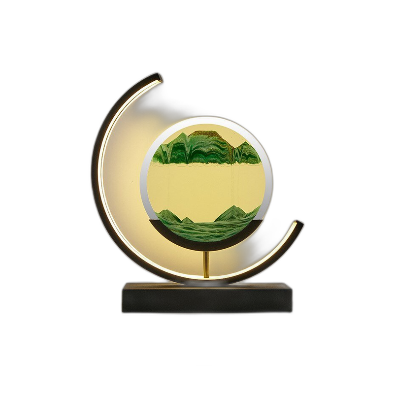 Moving sand art LED table lamp with green sand and a warm glowing crescent ring on a black base