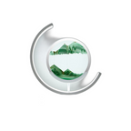 Close view of the moving sand art lamp with green sand forming layered mountains in the glass disc