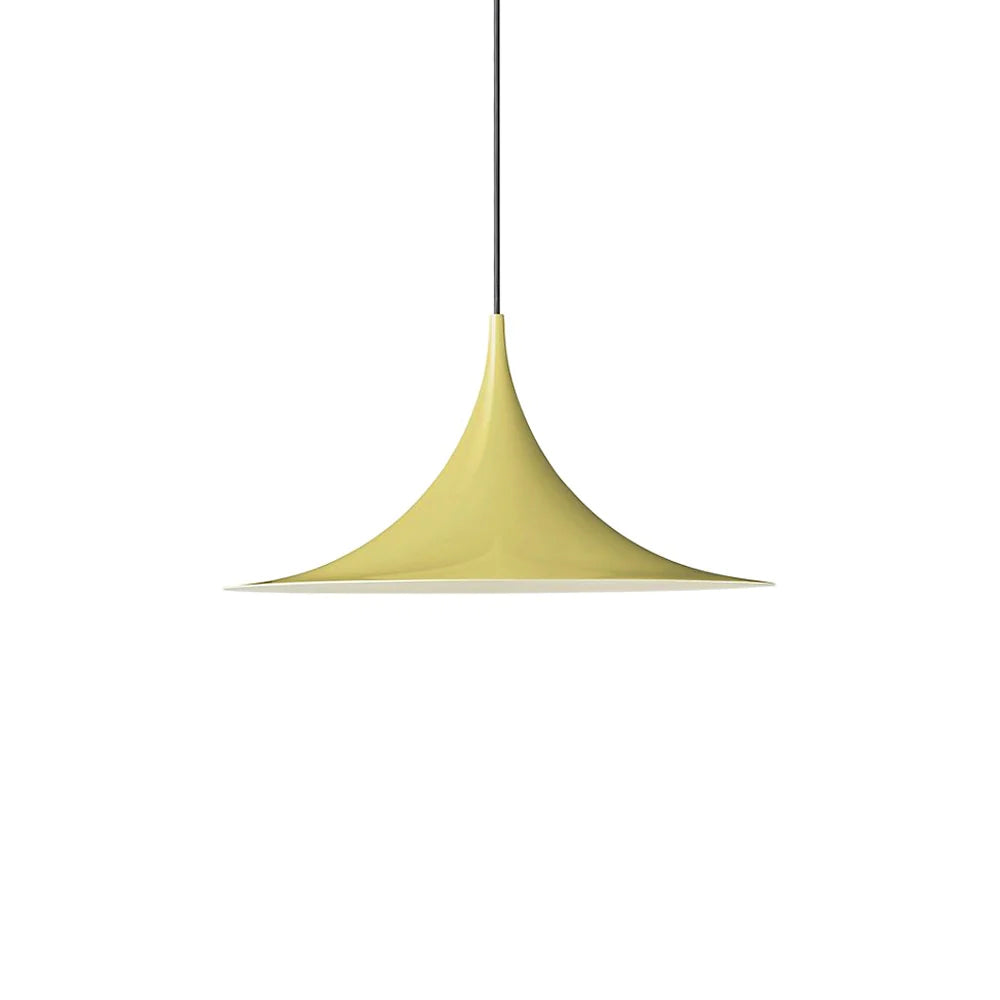 Arch-shaped pendant lighting a dining nook from above