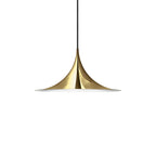 Arch pendant light over a kitchen island in a bright room