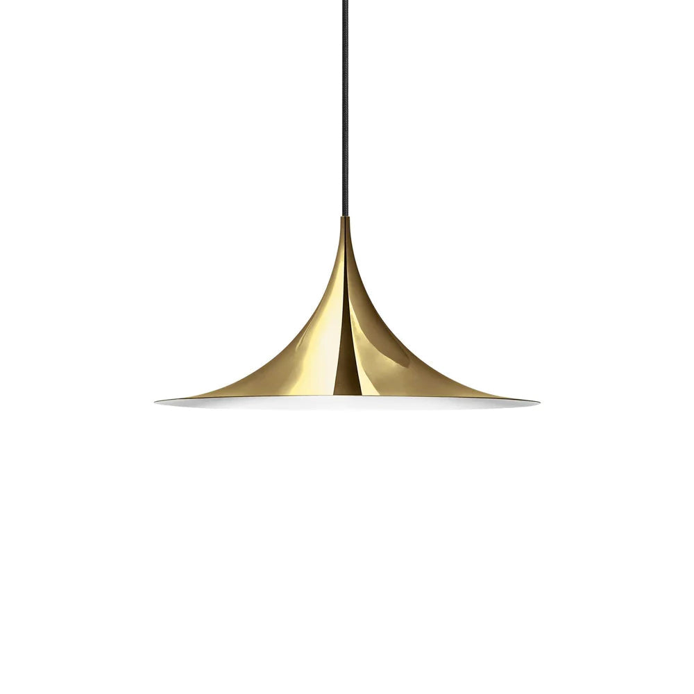 Arch pendant light over a kitchen island in a bright room