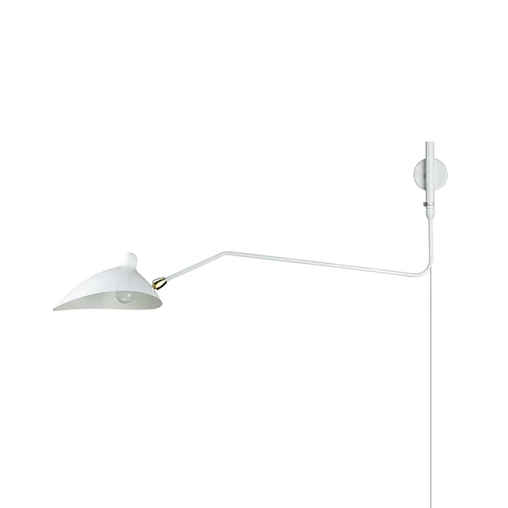 One-arm wall sconce mounted on a wall, slim arm and rounded shade