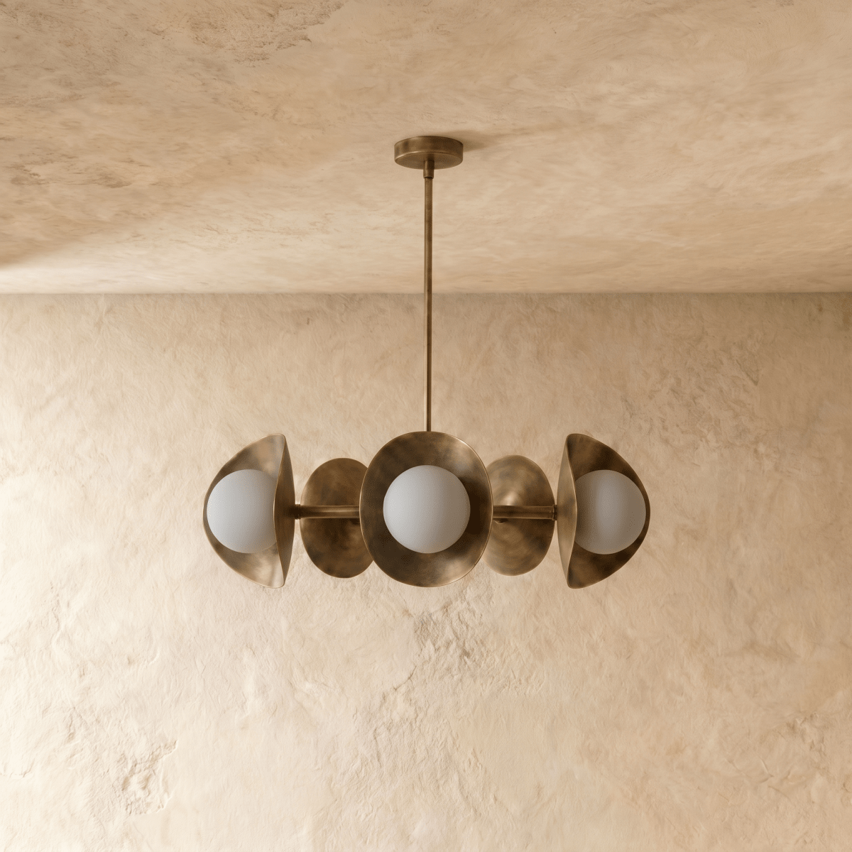 Clérachic chandelier in vintage brass, the disc shades and glass globes viewed from a slightly different angle.