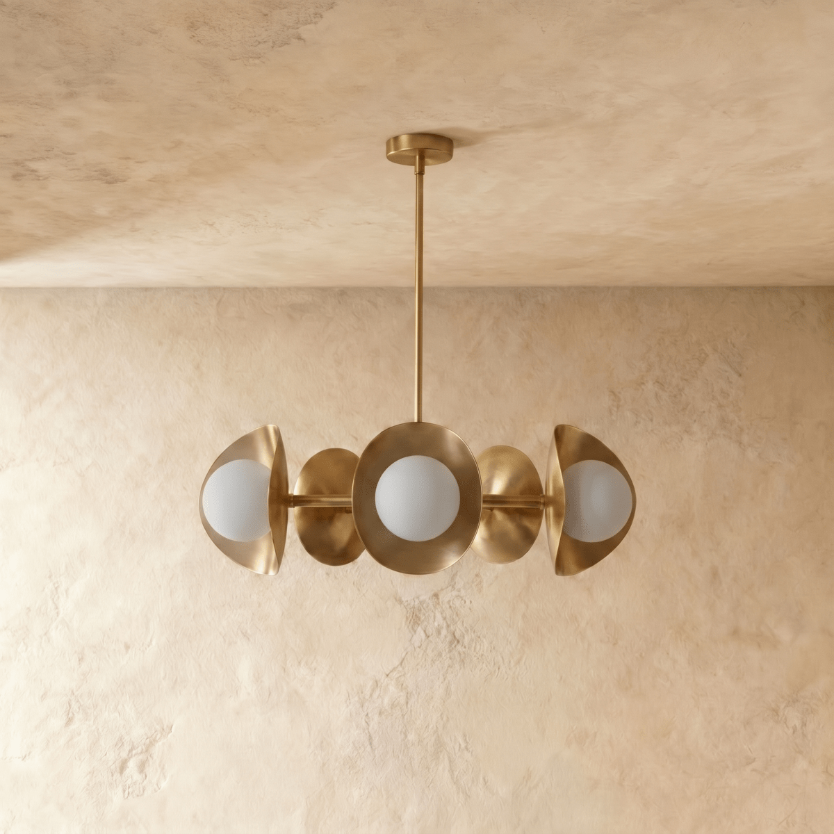 Clérachic chandelier in polished brass, the disc shades and glass globes viewed from a slightly different angle.