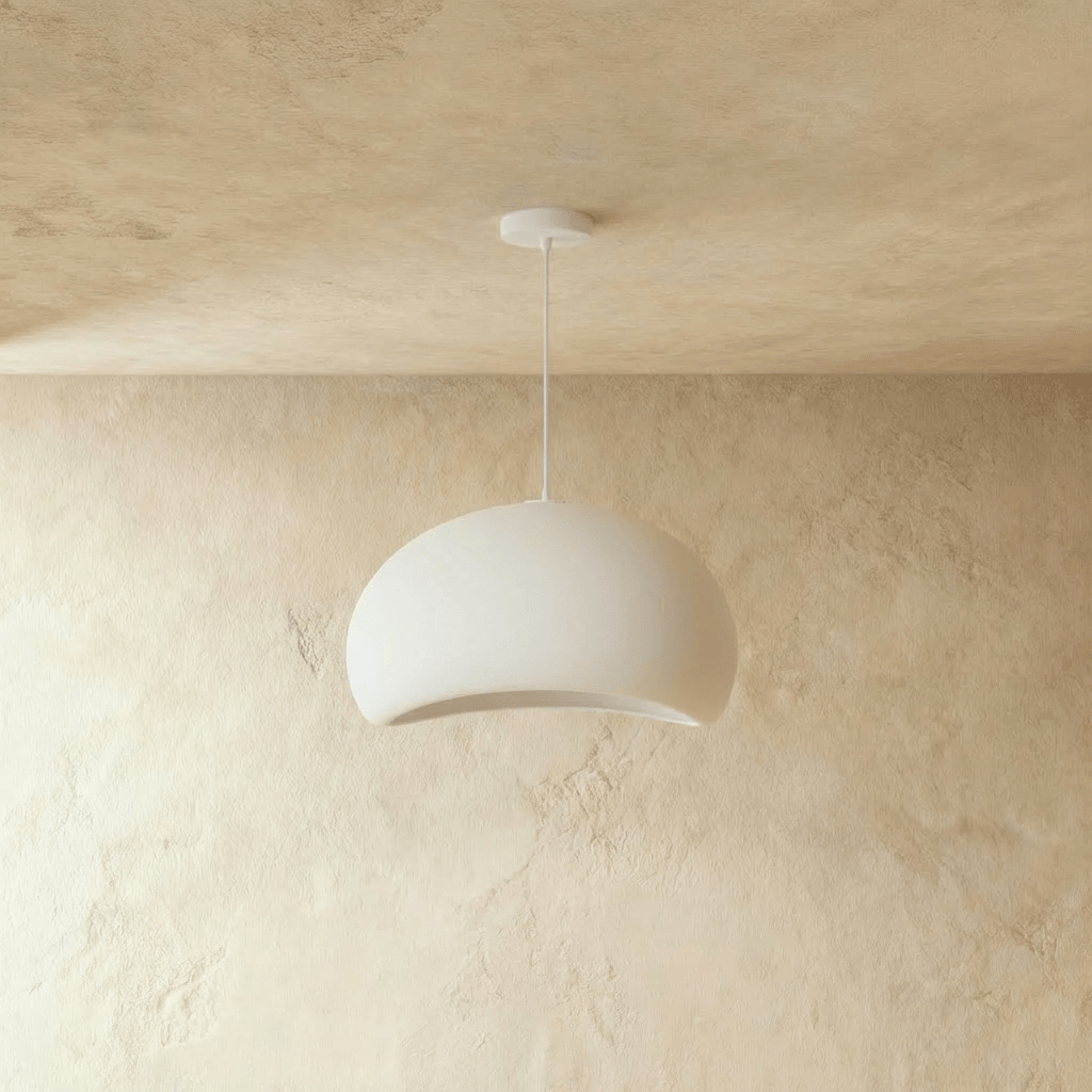 Clérachic Shibui pendant light in the Cloud form, shown unlit, the crescent underside reading as a plain shadowed recess.