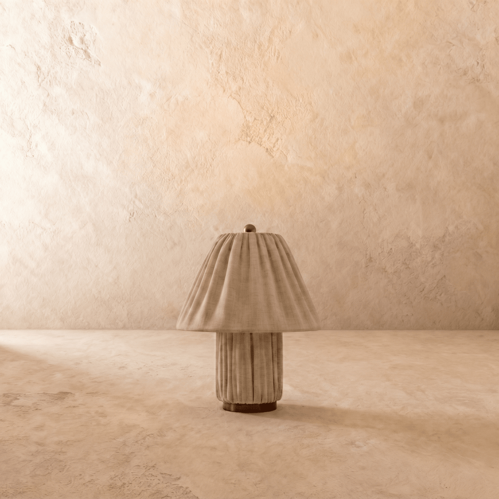 Clérachic table lamp in pleated beige fabric, a closer view of the fluted shade and column base.