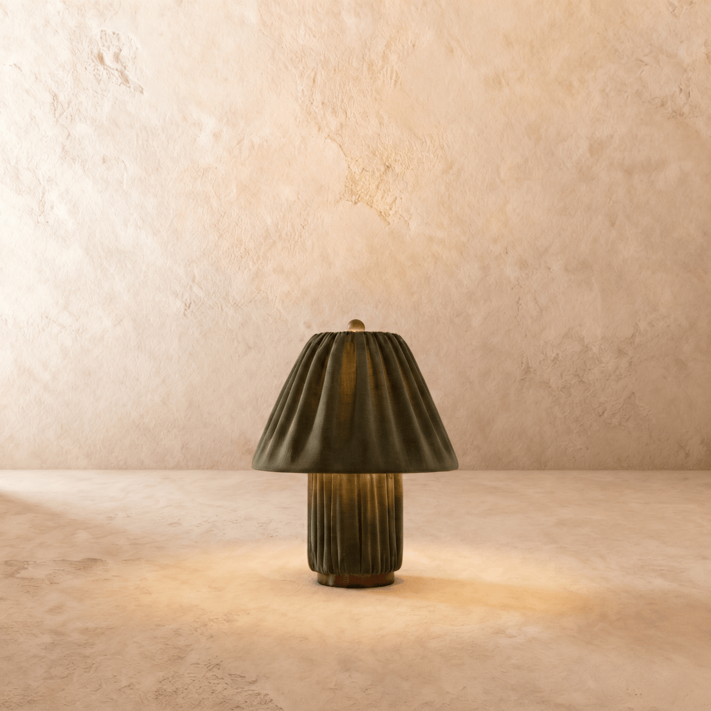 Clérachic table lamp in a pleated olive green fabric shade over a matching fluted column base.
