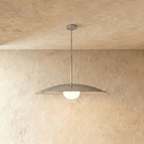 Clérachic pendant light in chrome, its saucer shade and opal diffuser hanging from a slender rod.