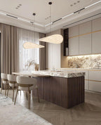 Paper pendant lamp clustered as multiple shades over a table