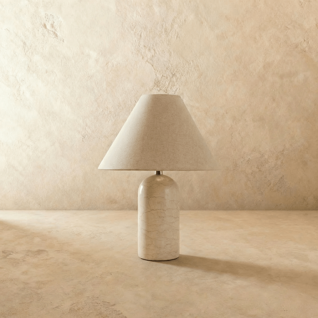 Clérachic Tresa table lamp with a white marble base, switched off, the shade reading as flat oatmeal cloth with no light behind it.