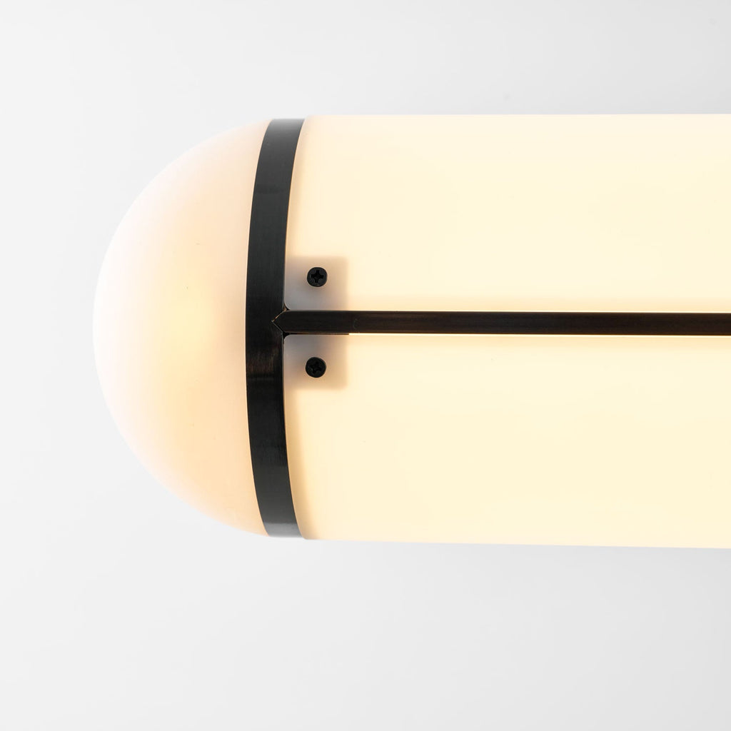 Linear pendant light suspended over a dining setting