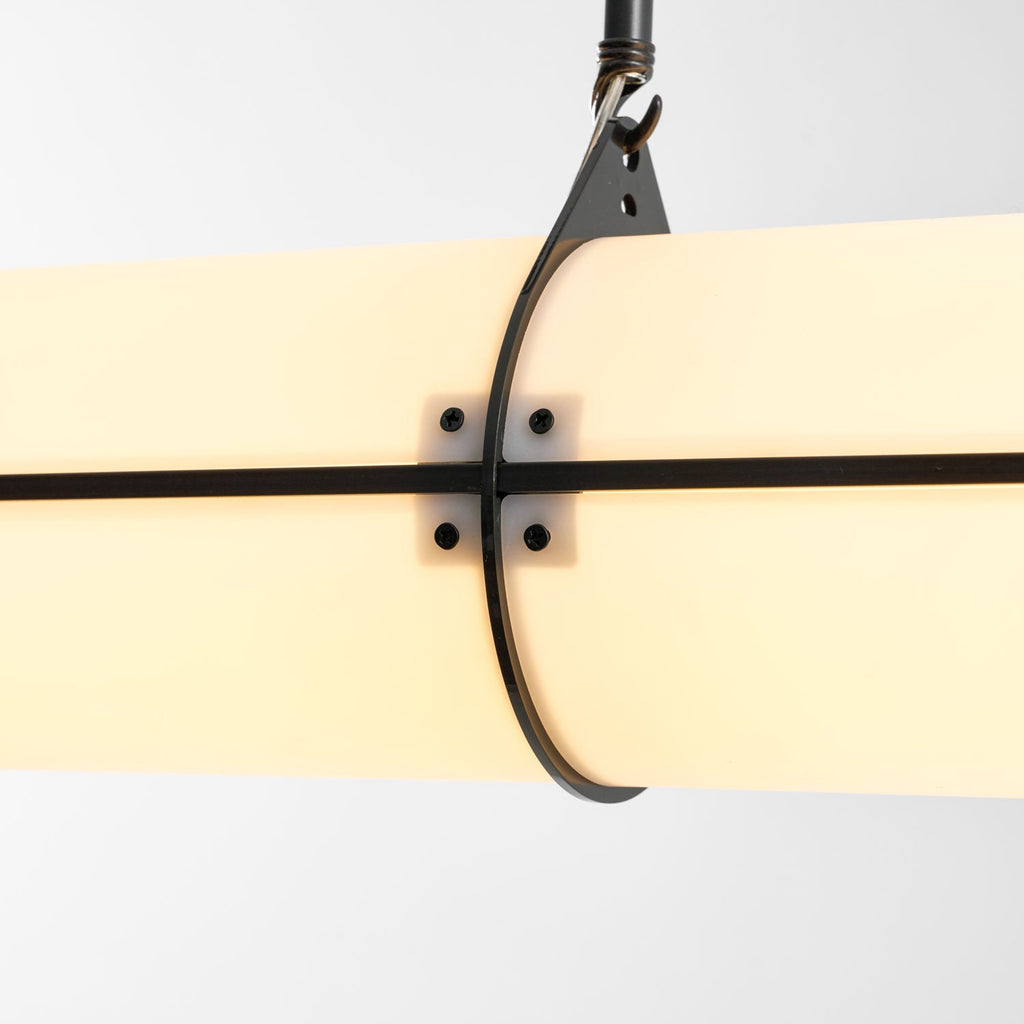Linear pendant light shown lit in a modern interior