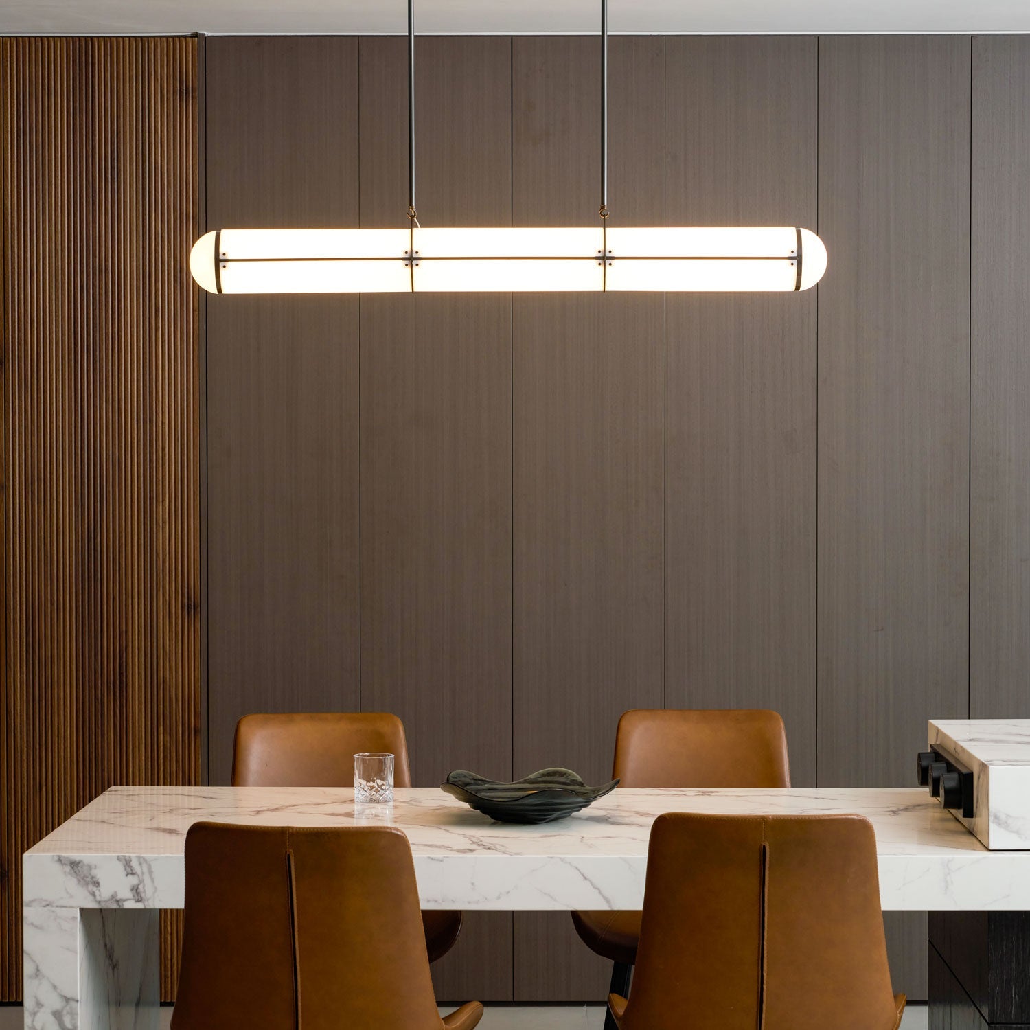 Linear pendant light shown lit against a plain background