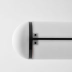 Linear pendant light shown in an architectural room