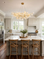 Gingko leaf chandelier hanging in a bright contemporary room