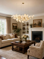 Gingko leaf chandelier glowing above an elegant seating area
