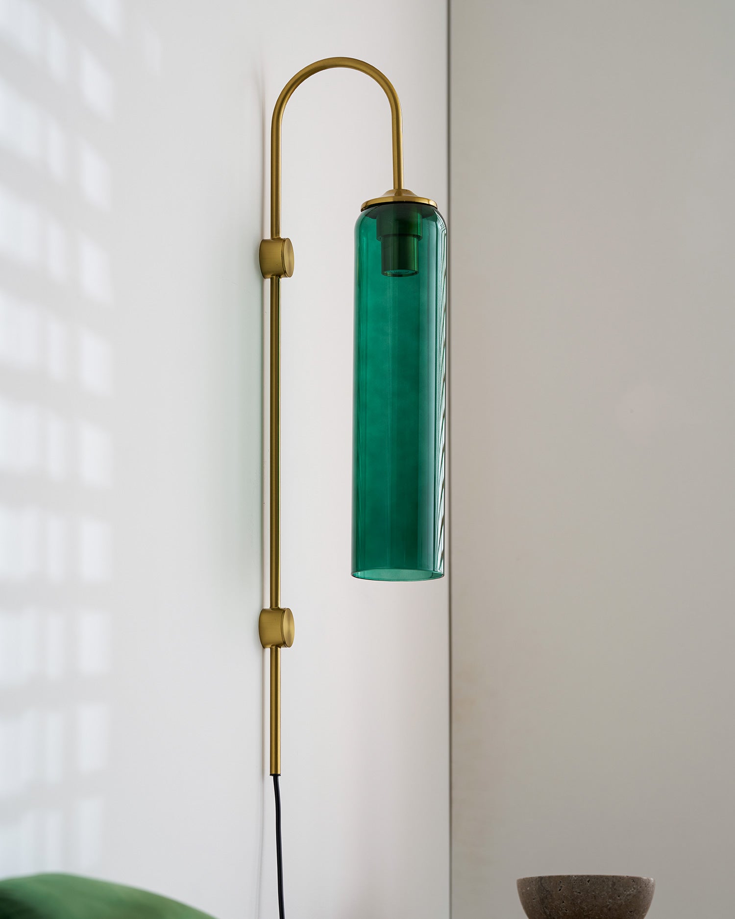 glass wall lamp interior scene of the lit cylindrical glass shade