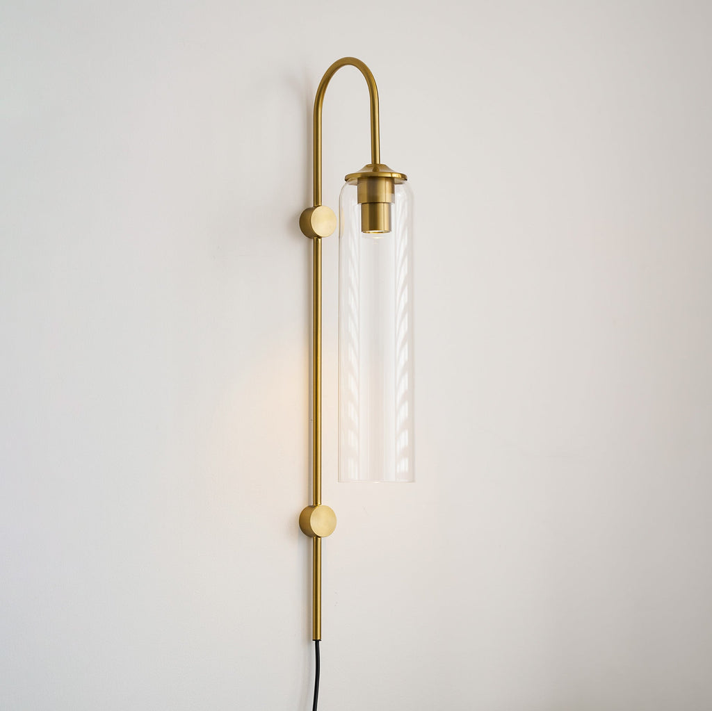 glass wall lamp lifestyle shot of the sconce in a styled space