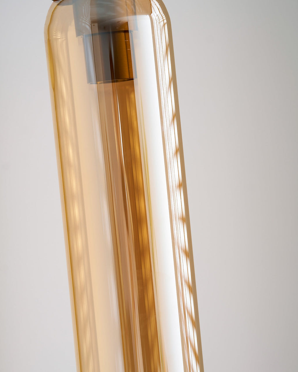 glass wall lamp lifestyle image of the warm glass shade glow