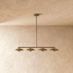 Clérachic vintage brass pendant light shown unlit and head-on, its single centre rod and horizontal bar forming a simple T-shaped silhouette against the wall.