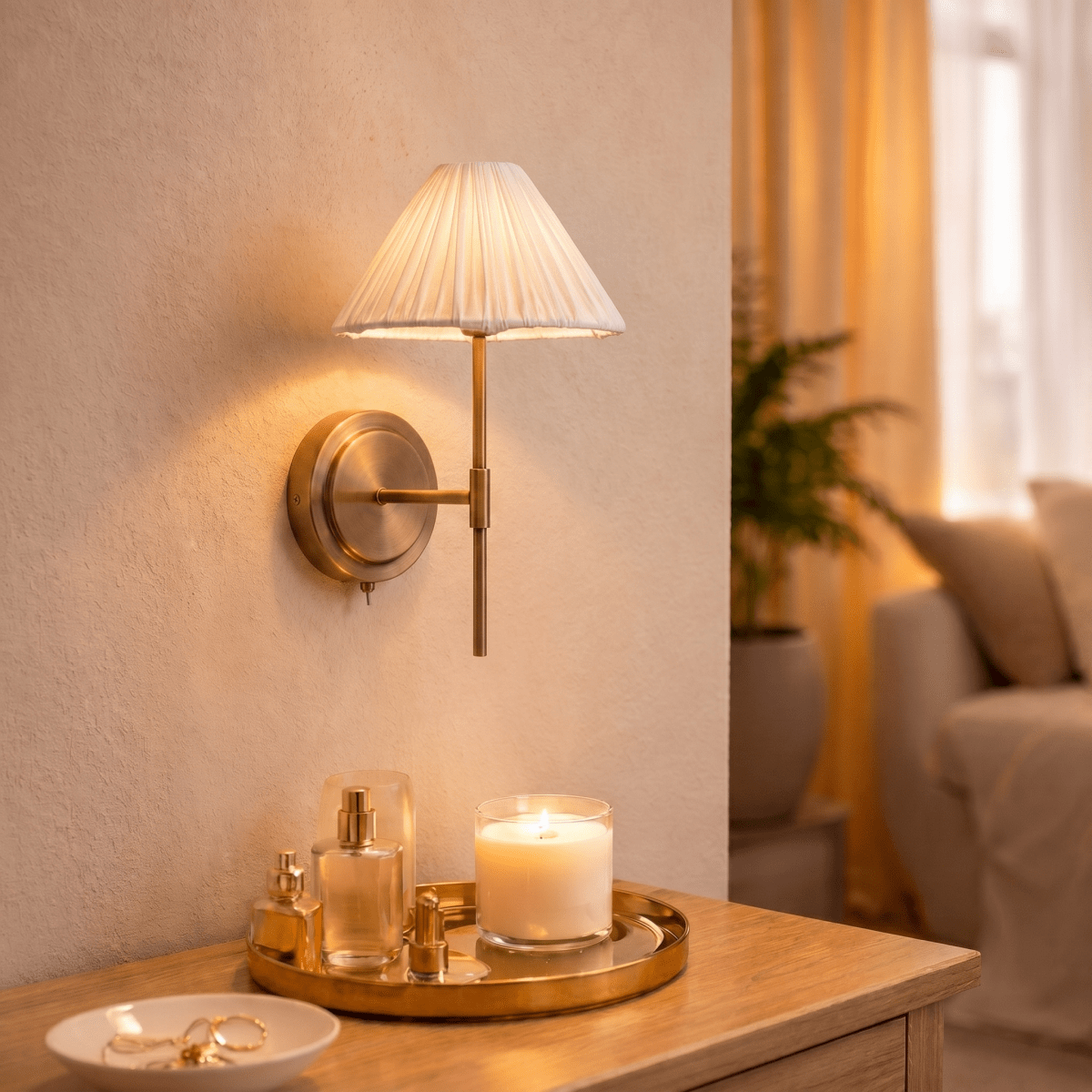 This Clérachic wall light glows above a tray of candles and scent bottles on a bedside dresser.