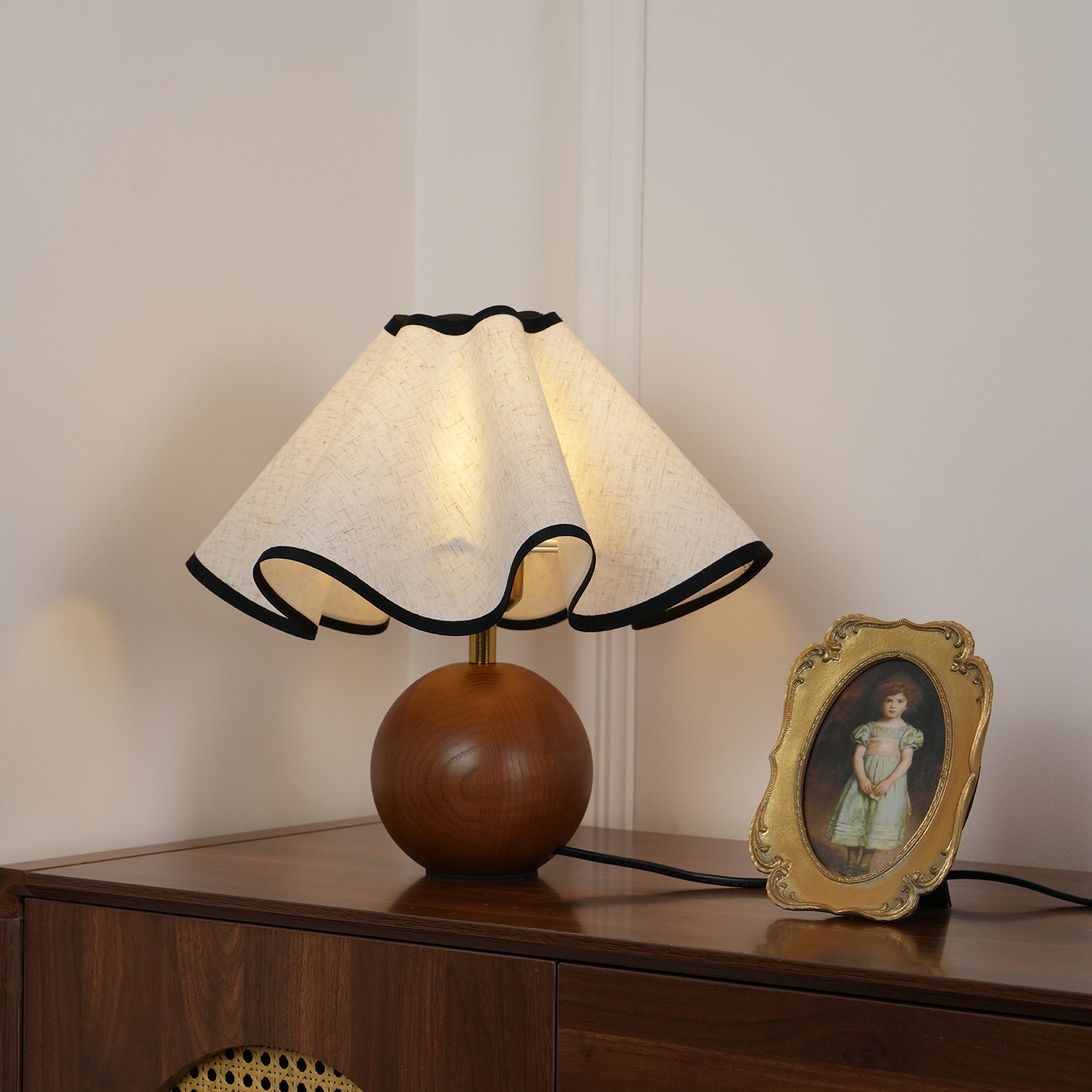 Wavecrest table lamp with linen shade beside decor accents